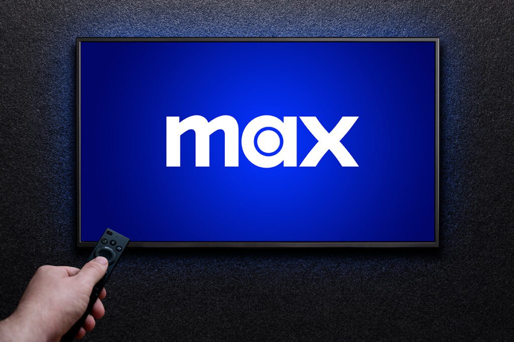 Man watching Max on large tv screen.